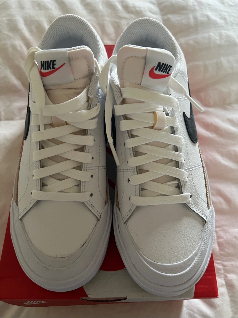 Nike women White Sneakers with Black Swoosh and Red Logo